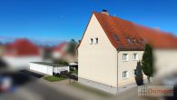 Attraktives Mehrfamilienhaus mit 3 Wohneinheiten und 5 Garagen – unvermietet und vielseitig nutzbar! - Luftaufnahme