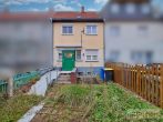 Reihenhaus mit Ausbaupotenzial und pflegeleichtem Grundstück in beliebter Lage von Merseburg. - Rückseite mit Hof